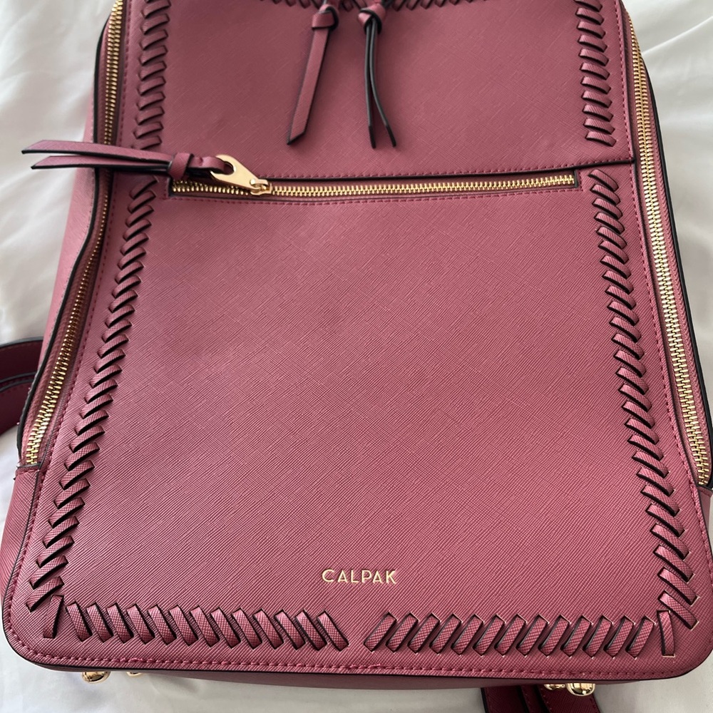 Calpak Red Backpack with Structured Design and Gold Accents